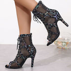 Lace-up high heel sandals from Plush Fashion Hub featuring strappy design and stiletto heels, stylish for evening wear.
