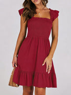 Women's smocked ruffle hem mini dress by Trendsi, casual lightweight summer dress with a stylish ruffled hem and comfortable fit.