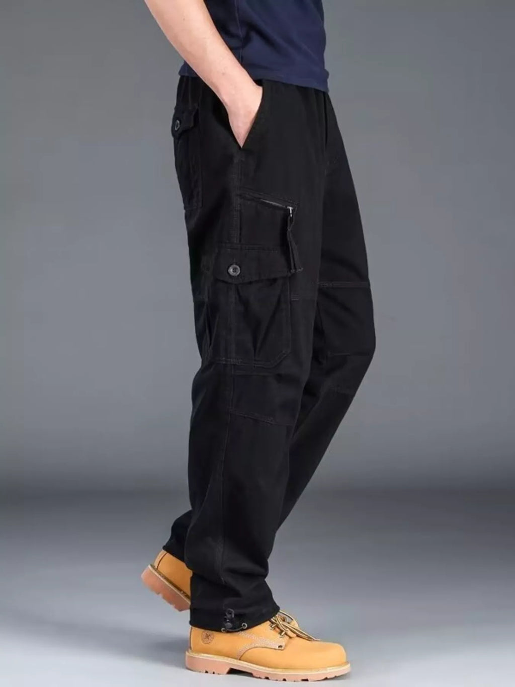 Men's plus size casual cargo pants by Trendsi, featuring multiple pockets and relaxed fit, shown in a neutral fabric.