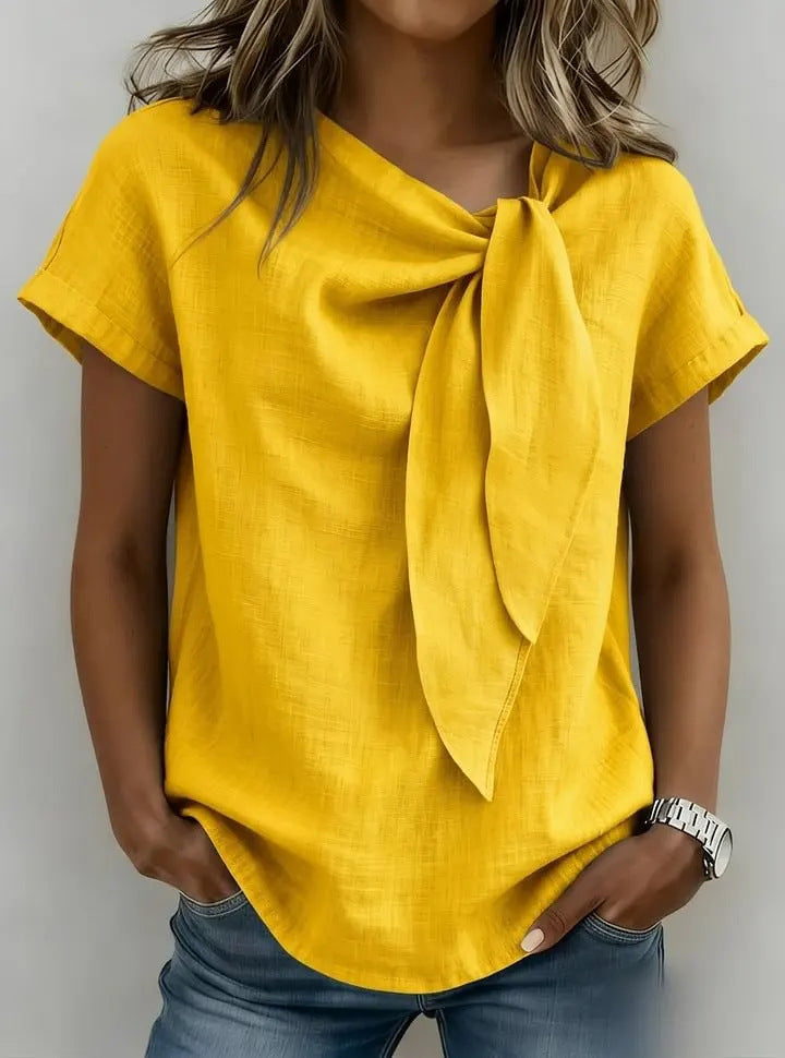 Women's loose-fit short sleeve casual pullover t-shirt by Plush Fashion Hub, shown in a relaxed fit with soft fabric.