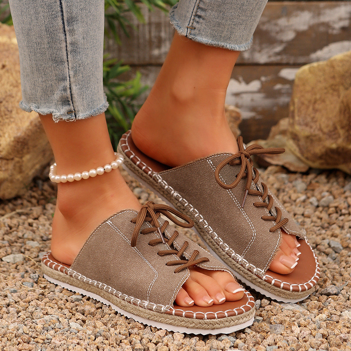 Women's lace-up open toe flat sandals in faux leather, stylish footwear by Trendsi with a modern design and comfortable fit.
