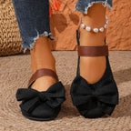 Women's chic bow round toe slip-on flats made of vegan leather, stylish and comfortable shoes by Trendsi.
