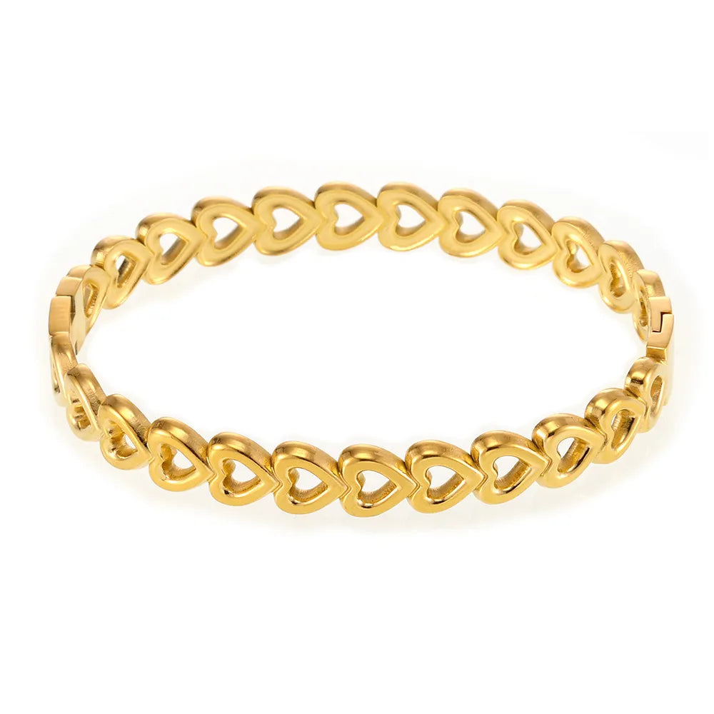 18K gold-plated stainless steel heart bracelet with delicate chain and charm, featuring elegant, shiny finish and stylish design.