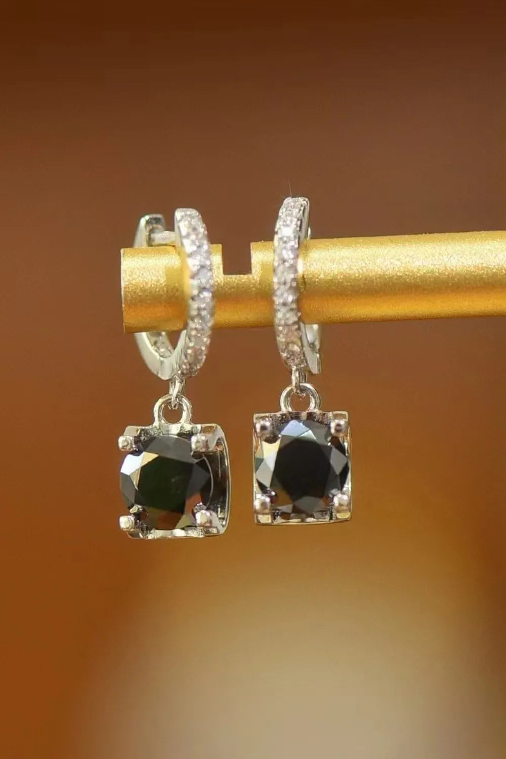 Sterling silver moissanite drop earrings with 2 carats, featuring elegant design and sparkling gemstones.