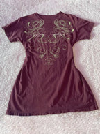 Graphic round neck short sleeve T-shirt from Trendsi, casual tops with a stylish design, shown on a hanger.