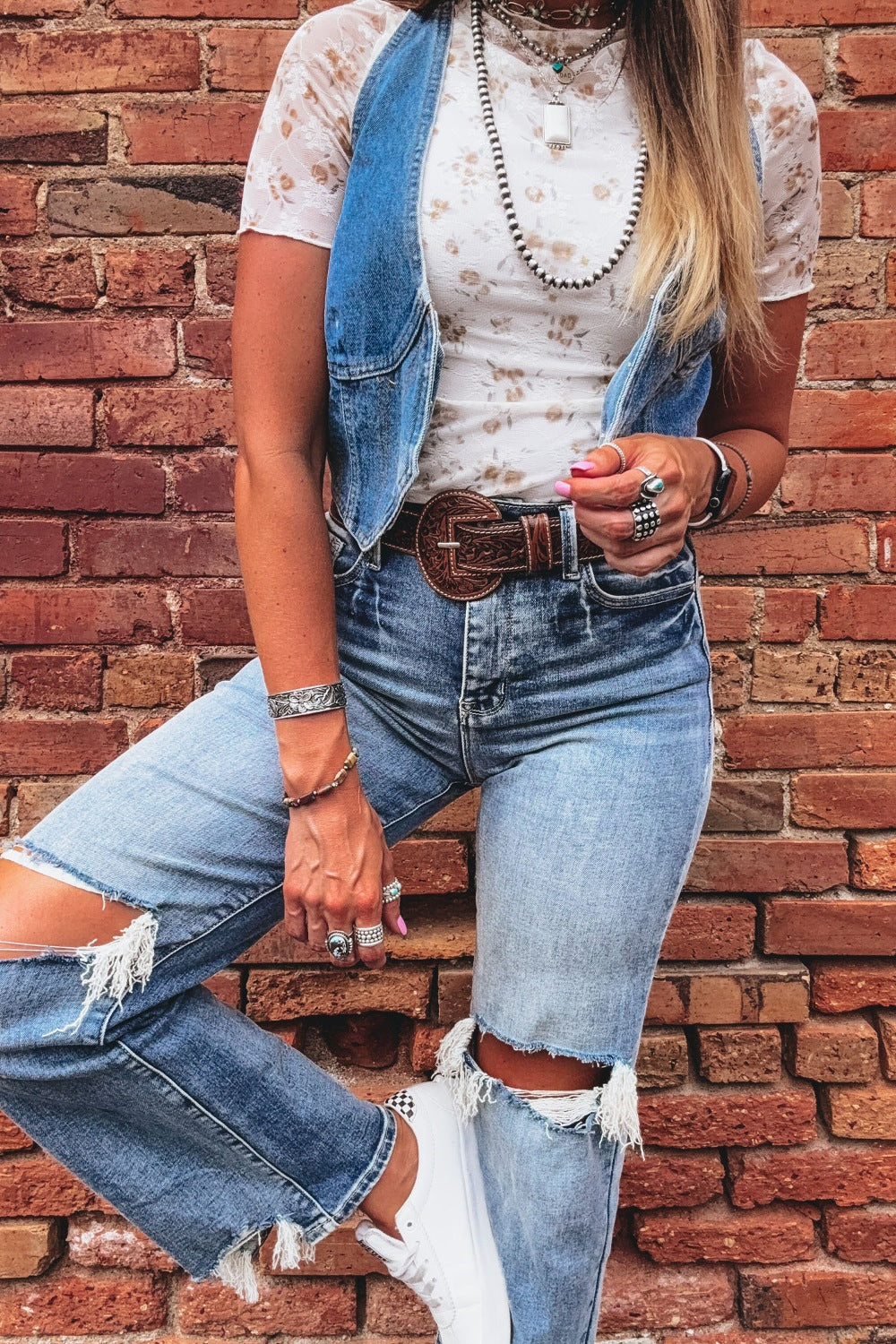 Floral lace mock neck fitted short sleeve T-shirt from Trendsi, featuring delicate lace details and a sleek, form-fitting design.