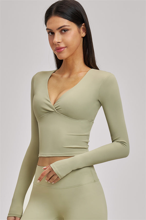 Fitglutes Activewear long sleeve crop top with fitted design, soft fabric, and stylish look for workout and gym activities.