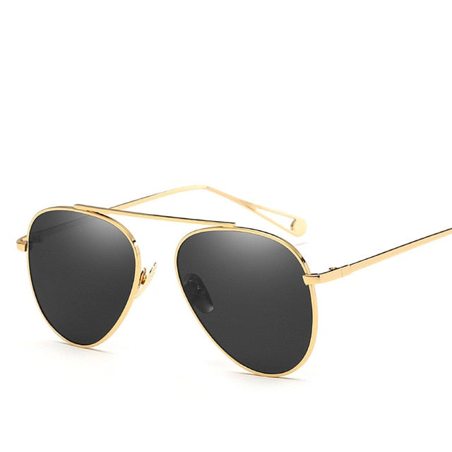 Plush Fashion Hub pilot women's sunglasses with vintage aviation style, featuring classic frame and tinted lenses.