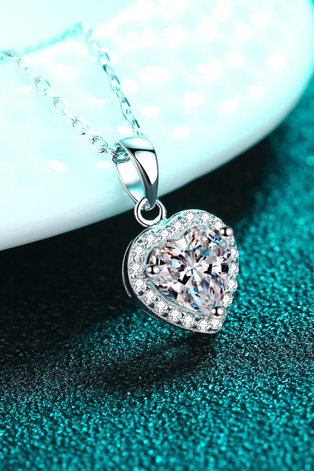 1 Carat Moissanite heart pendant necklace with chain, featuring a sparkling moissanite gemstone in a heart shape.
