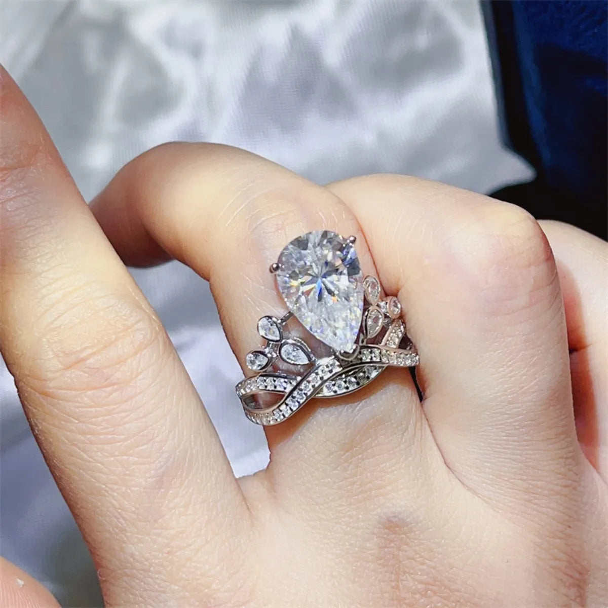 Sterling silver ring with a 5-carat Moissanite gemstone, showcasing a sparkling, elegant design.