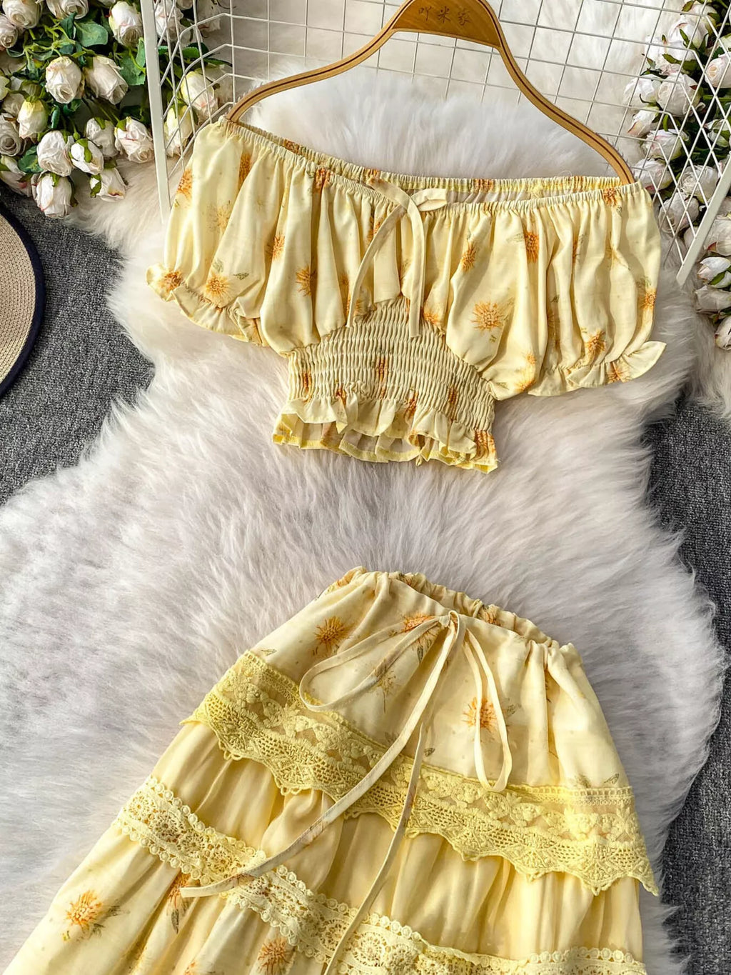 Smocked floral top and skirt set by Shopimist, featuring a coordinated design with ruffled details and vibrant flower patterns.
