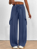 Women's high-waisted casual cargo pants with drawstring, lightweight utility style, featuring multiple pockets and a relaxed fit.