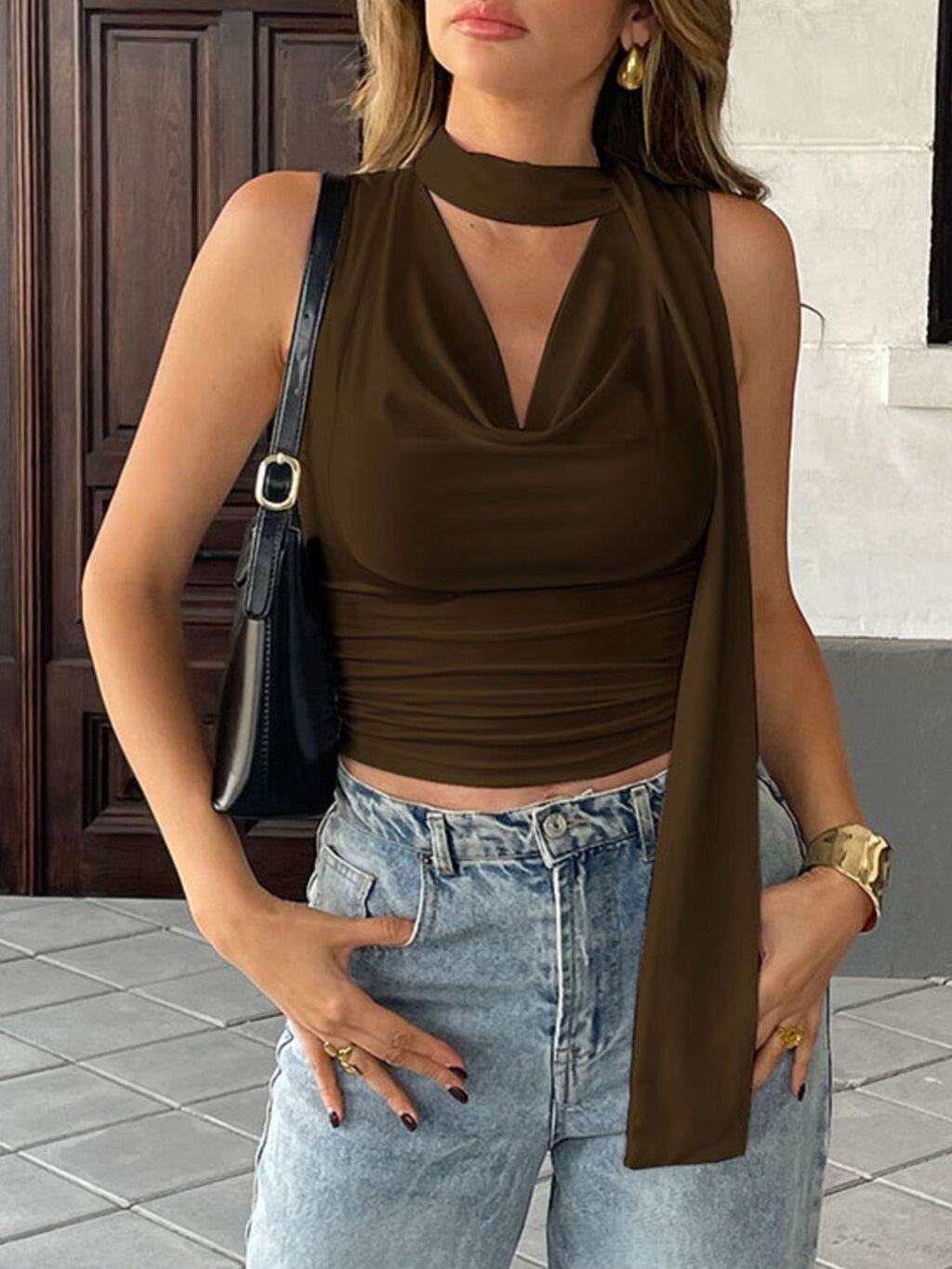 Satin-feel sleeveless cami top with cowl neck and ruched details, versatile blouse in a stylish, elegant design.
