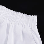 Women's ruffled linen-blend cropped blouse and shorts set by FitiqueFit, featuring a stylish ruffled top and matching shorts.