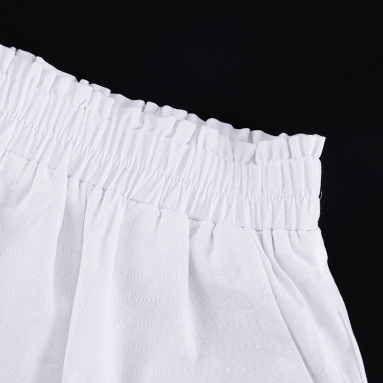 Women's ruffled linen-blend cropped blouse and shorts set by FitiqueFit, featuring a stylish ruffled top and matching shorts.