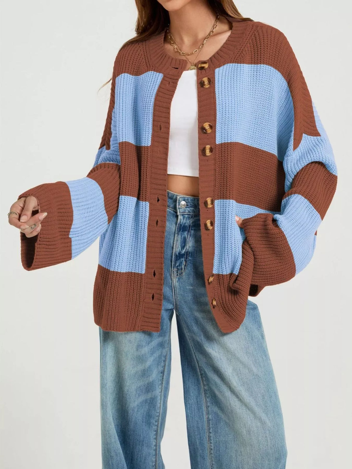 Color block striped button-up cardigan by Trendsi featuring vibrant color blocks, long sleeves, and a classic button-front design.