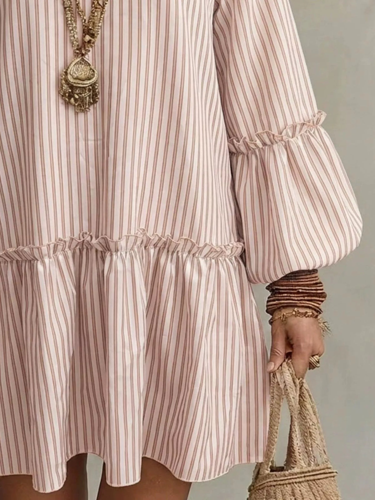 Plus size striped balloon sleeve mini dress by Trendsi featuring bold vertical stripes and a relaxed fit, perfect for casual wear.