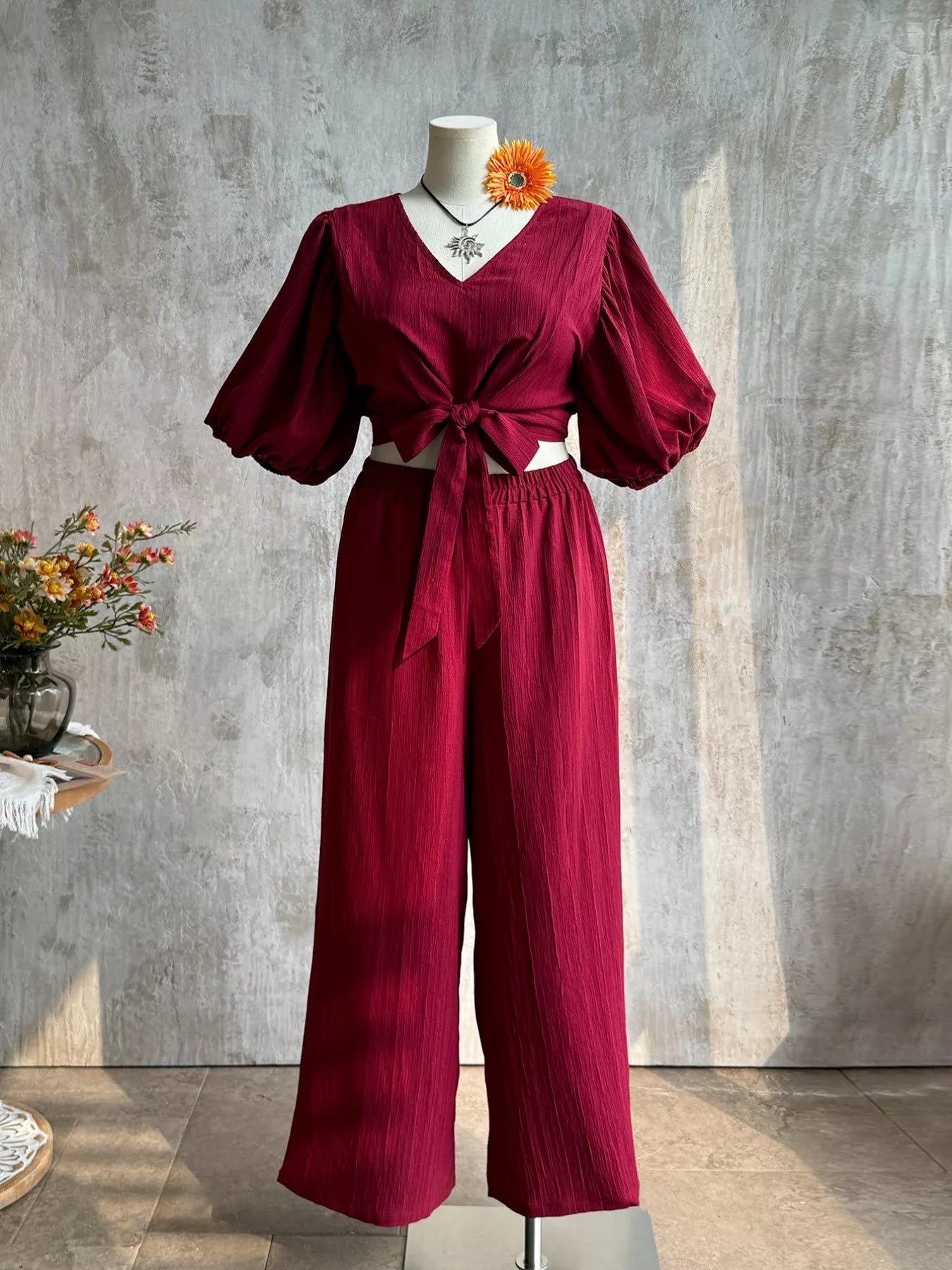 Plus size tie-front puff sleeve top and wide-leg pants set by Plush Fashion Hub, featuring a stylish two-piece outfit.