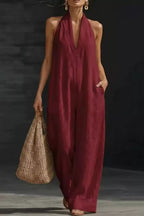 Women's sleeveless wide-leg jumpsuit with pockets, casual chic romper by Trendsi, shown in a stylish, comfortable fit.