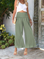 Women's wide-leg smocked waist casual trousers from Trendsi, lightweight and comfortable pants with a relaxed fit.