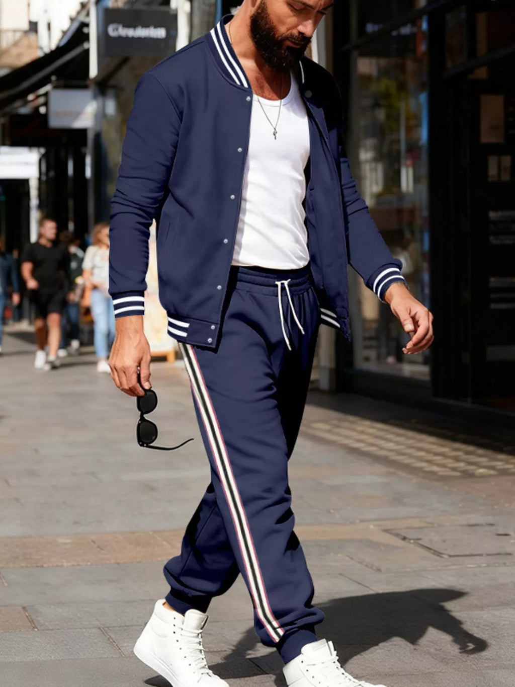 Men's plus size striped snap-down top and pants set by Trendsi, featuring a stylish full-length top and matching pants.