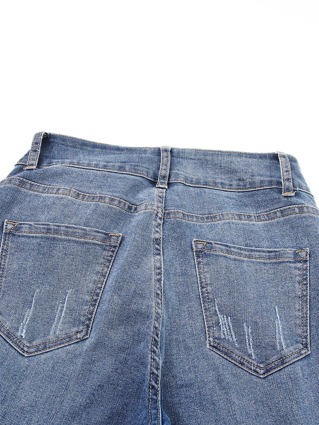 High waist distressed straight leg jeans by Trendsi, showing faded denim, ripped details, and classic fit on a model.