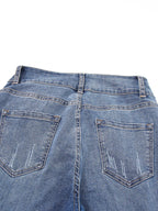 High waist distressed straight leg jeans by Trendsi, showing faded denim, ripped details, and classic fit on a model.