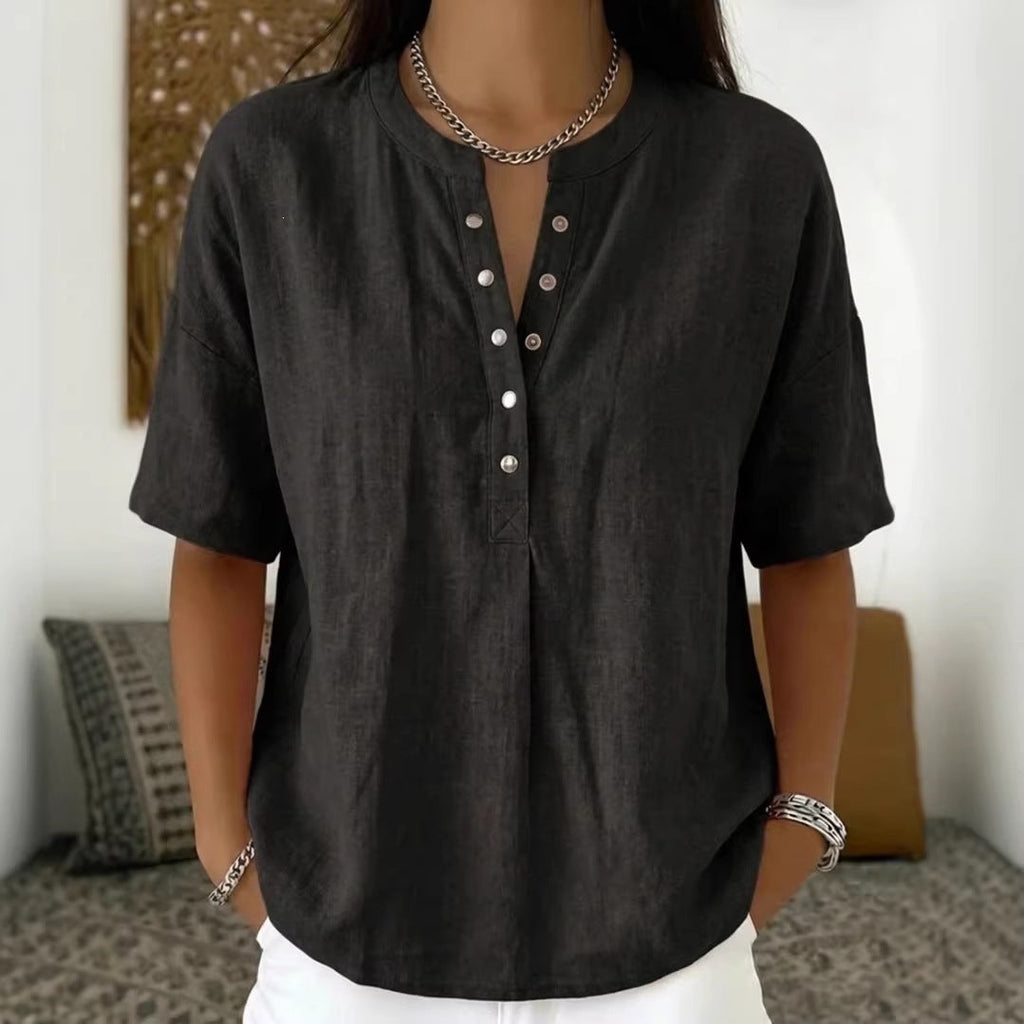 Women's loose-fit short-sleeve pullover top in solid color from Plush Fashion Hub, casualwear style, shown on a model.