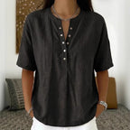 Women's loose-fit short-sleeve pullover top in solid color from Plush Fashion Hub, casualwear style, shown on a model.