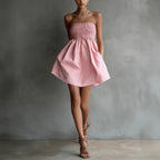 Women's strapless tube mini dress by FitiqueFit featuring a solid color and elastic waist, perfect for casual wear.