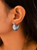 18K gold-plated stainless steel huggie earrings with a sleek, minimalist design and polished finish.