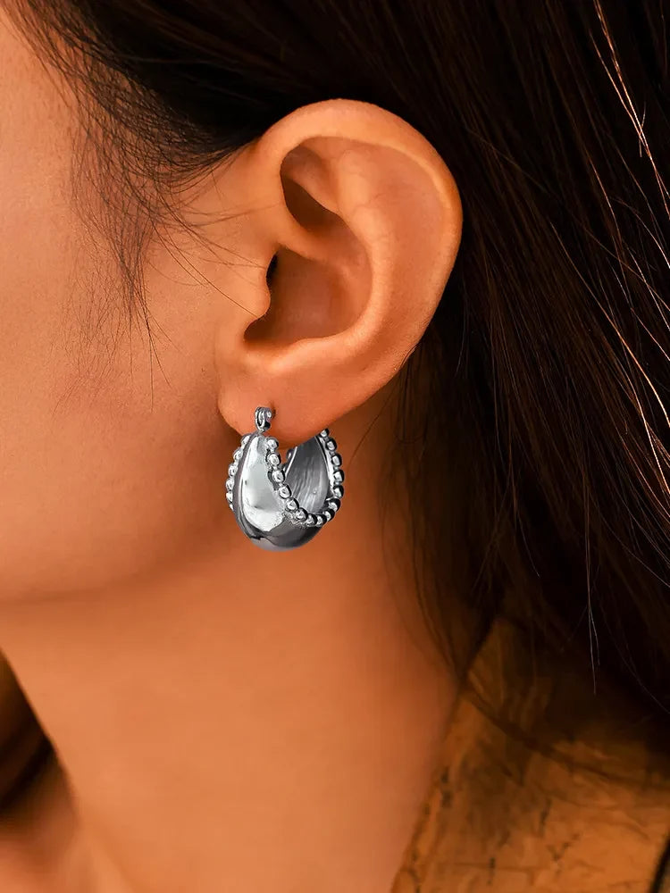 18K gold-plated stainless steel huggie earrings with a sleek, minimalist design and polished finish.