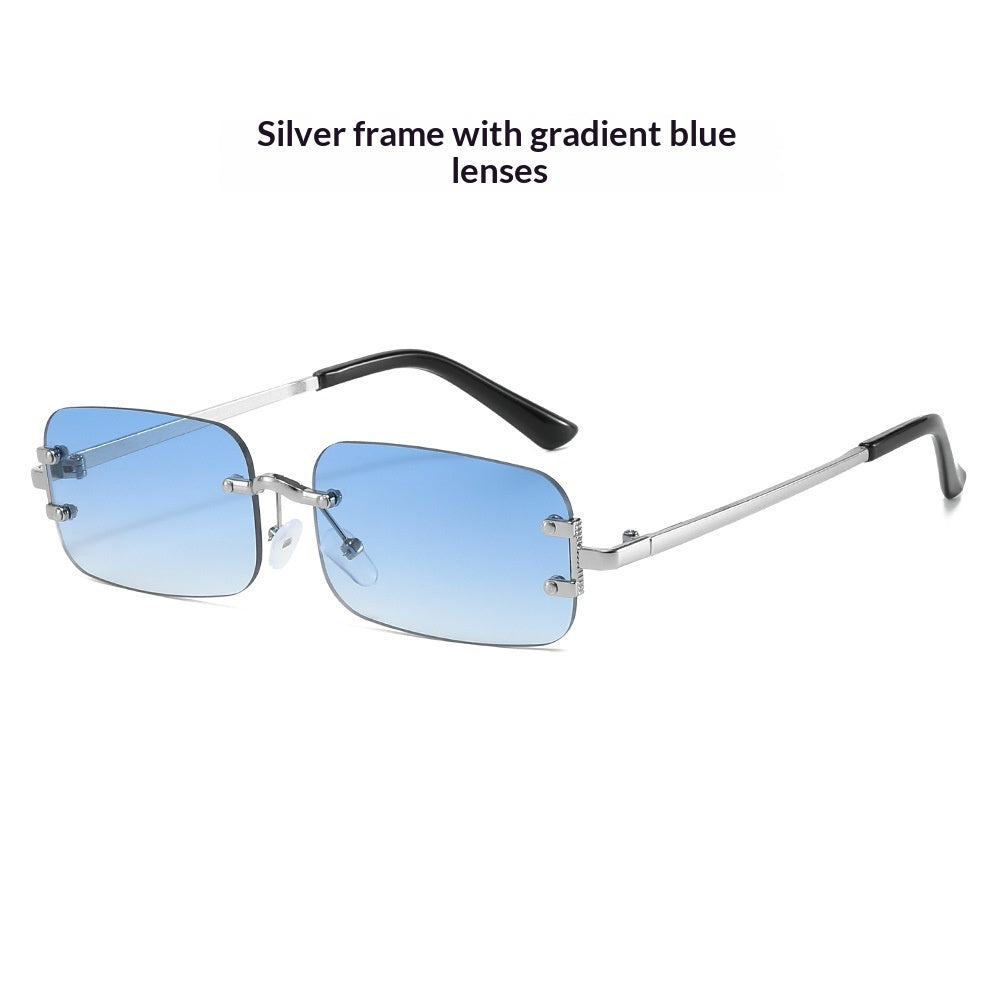 Pair of frameless rimless sunglasses with sleek Western style design, featuring clear lenses and minimal metal accents.