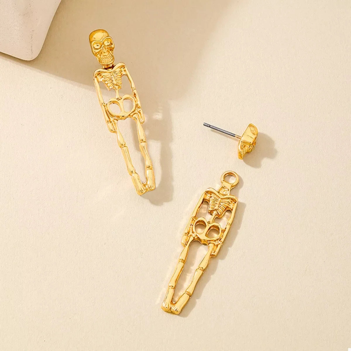 Halloween 18K gold-plated skeleton earrings with detailed bone design, perfect for spooky seasonal fashion.