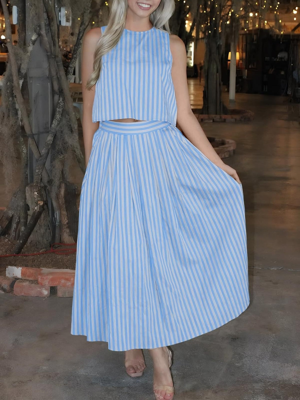 Women's striped sleeveless top and midi skirt two-piece set by Trendsi, featuring a stylish matching outfit with vibrant stripes.