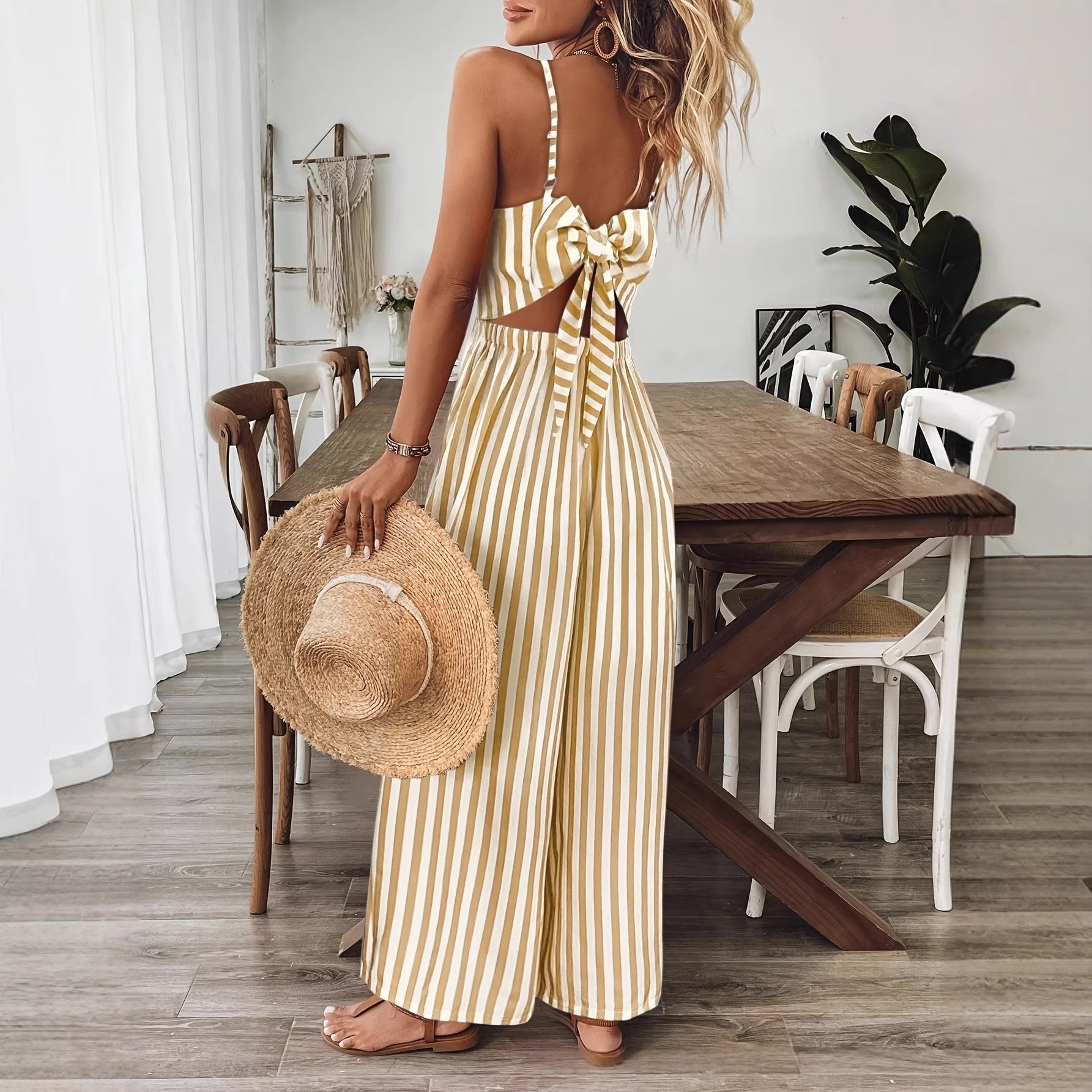 Ginger yellow printed backless sleeveless strap jumpsuit from FitiqueFit, featuring a relaxed fit and stylish design.