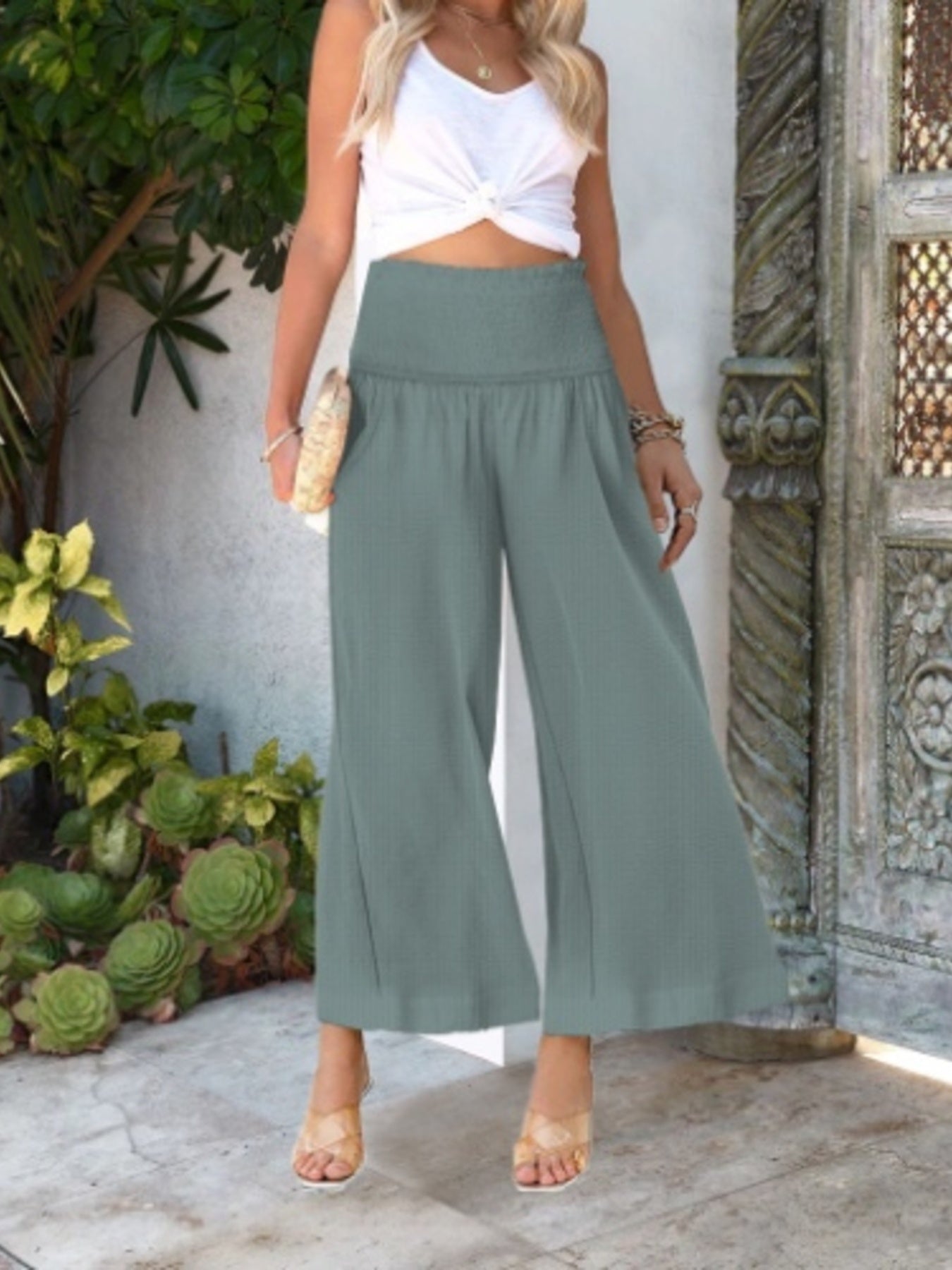 Women's lightweight wide-leg casual trousers with smocked waist, comfortable and stylish pants by Trendsi.