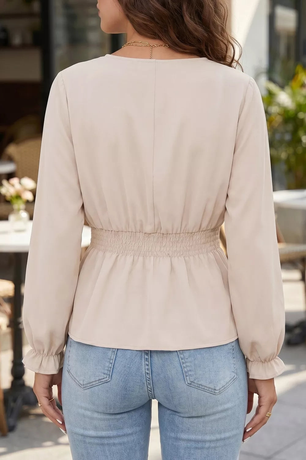 V-neck long sleeve smocked waist blouse by Plush Fashion Hub, featuring elegant design and chic style.