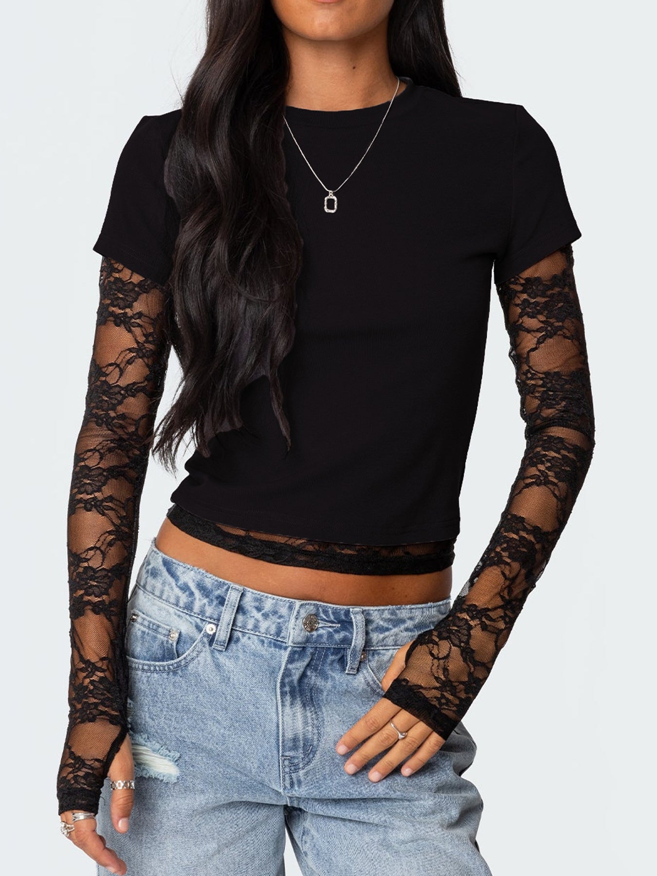 Women's elegant lace sleeve fitted T-shirt by Trendsi featuring sophisticated lace details and a casual, stylish fit.