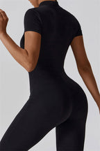 Fitglutes activewear Mia Belle jumpsuit in black, form-fitting sportswear with a sleek design for gym and workout sessions.