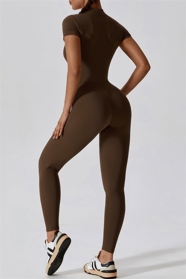 Black Mia Belle jumpsuit by Fitglutes Activewear, featuring a fitted design with sporty straps and breathable fabric.