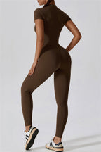 Black Mia Belle jumpsuit by Fitglutes Activewear, featuring a fitted design with sporty straps and breathable fabric.