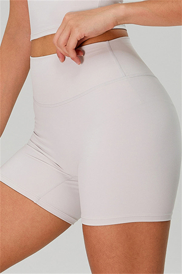 Fitglutes activewear one-shoulder crop top and matching shorts 2-piece set for workout and sportswear, shown in the image.