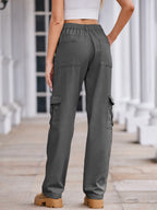 VYSN straight denim cargo pants showing front view, featuring multiple pockets and classic blue denim fabric.