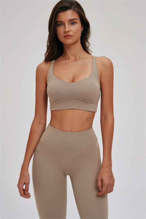 Kinetic Cross Back Sports Bra and Leggings set by Fitglutes Activewear, featuring black athletic workout clothes with supportive design.