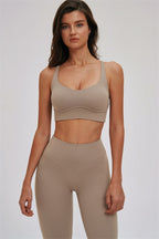 Kinetic Cross Back Sports Bra and Leggings set by Fitglutes Activewear, featuring black athletic workout clothes with supportive design.