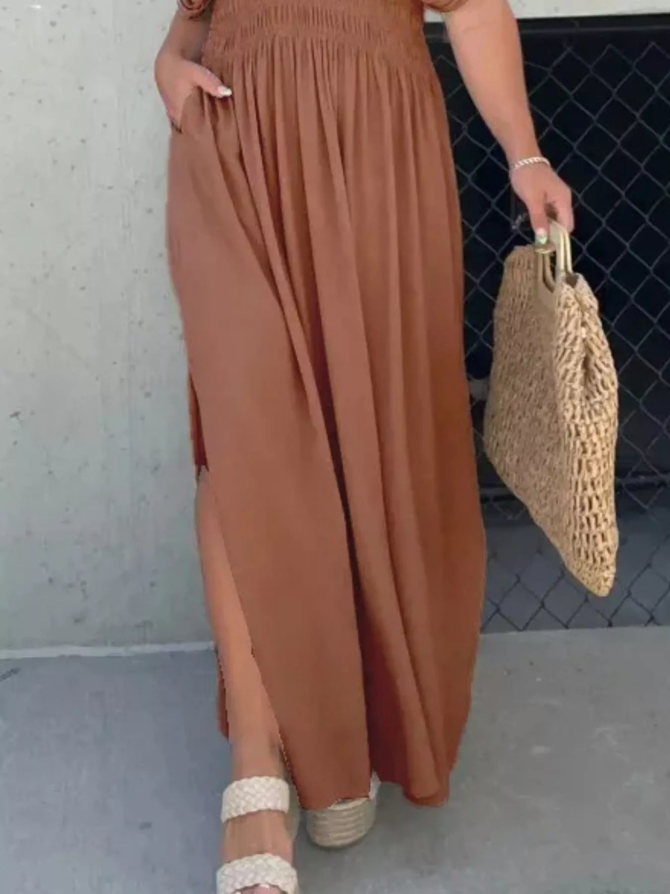 Plus size full length maxi dress with slit, V-neck, smocked waist, from Trendsi, featuring a flowing fabric and elegant design.