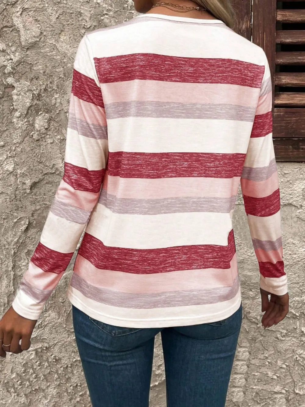 Contrast striped V-neck long sleeve T-shirt from Trendsi, featuring bold horizontal stripes and a relaxed fit.