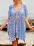 Openwork V-neck slit cover-up by Trendsi, lightweight and breezy with intricate openwork design, perfect for beach or poolside wear.