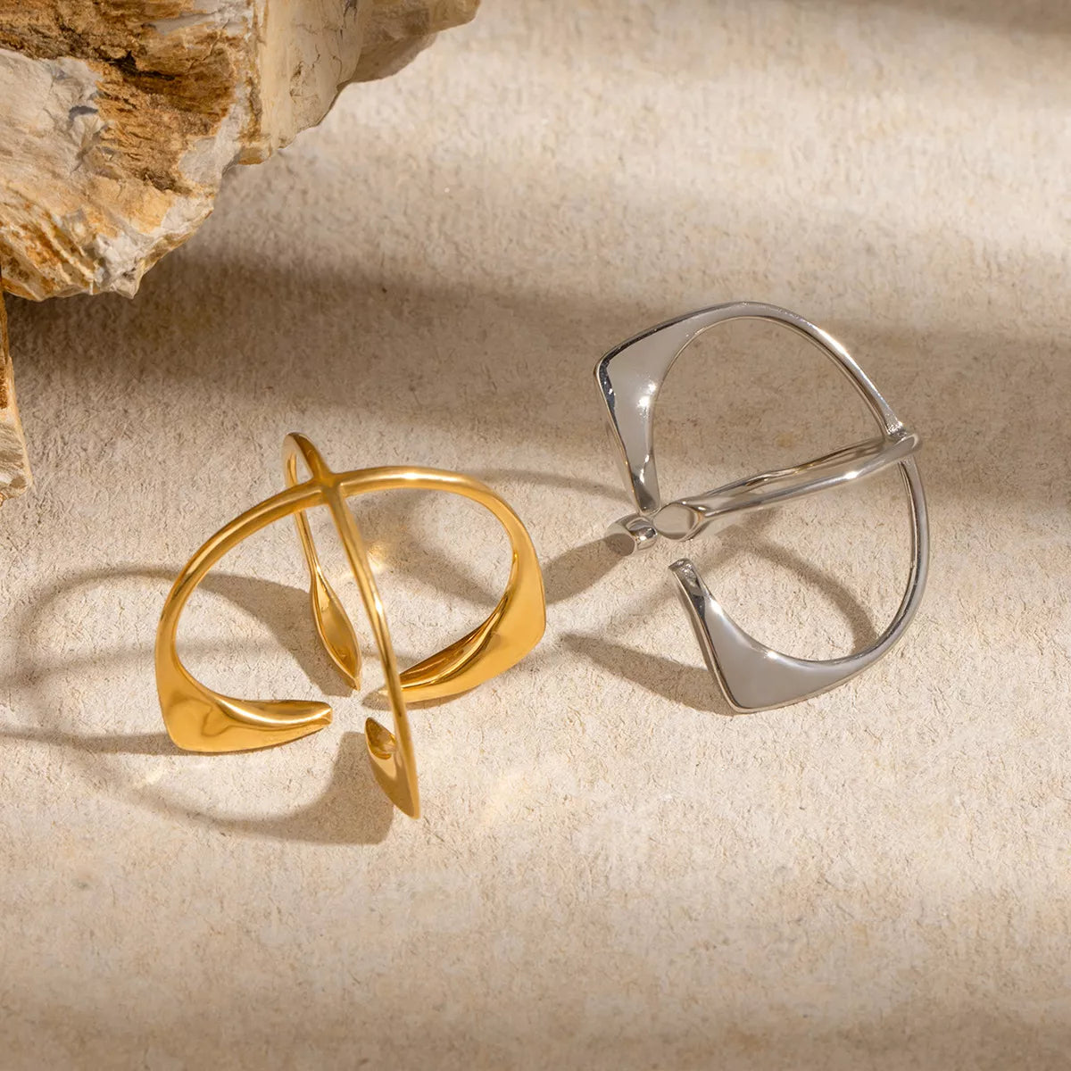 Stainless steel crisscross open ring with sleek design, perfect for stylish jewelry fashion from Plush Fashion Hub.